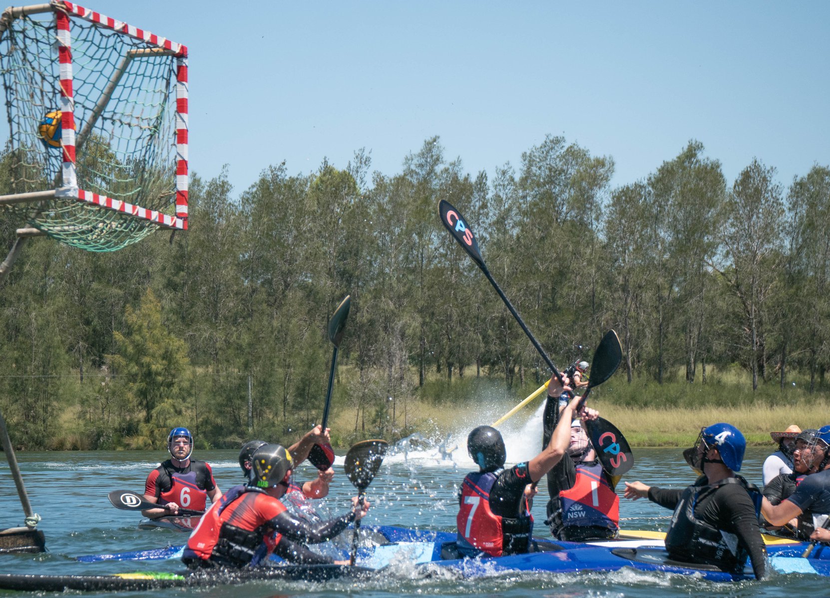Canoe polo action shot - players competing for the ball