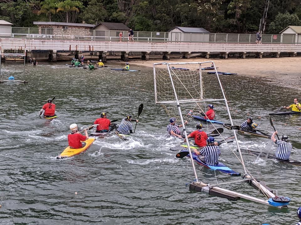 Canoe polo gameplay on the water