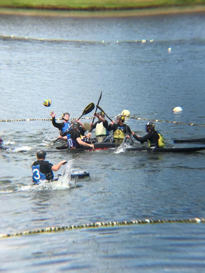 Canoe polo team in action